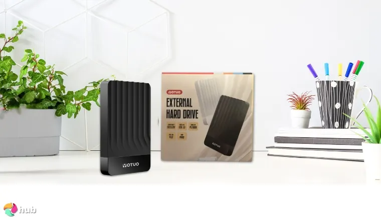 YOTUO 1TB Portable External HDD on a white office desk in a well-lit setting for a review