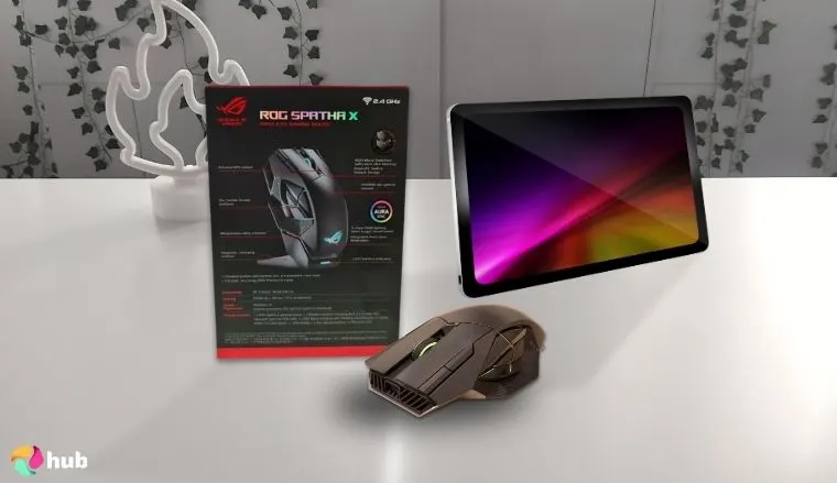 ASUS ROG Spatha X MMO Mouse on a white office desk with simple styling for a review