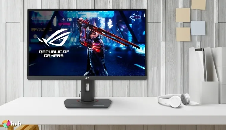 ASUS ROG Strix 27” XG27ACS Monitor on a white office desk in a well-lit setting for a review