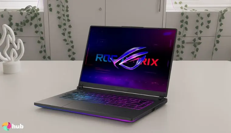 ASUS ROG Strix G16 240Hz gaming laptop on a white office desk with natural light ready for a review