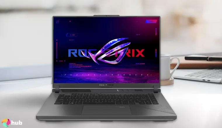 ASUS ROG Strix G16 Gaming Laptop on a white office desk with soft lighting for a review