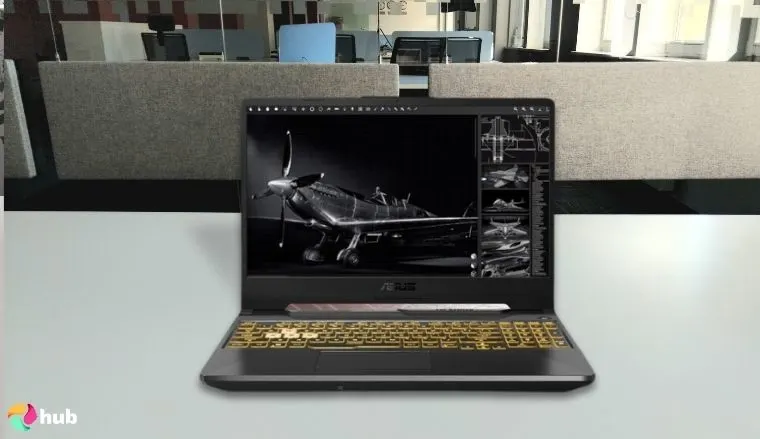 Asus TUF Gaming A15 Gaming Laptop on a white office desk in a clean setup for a review