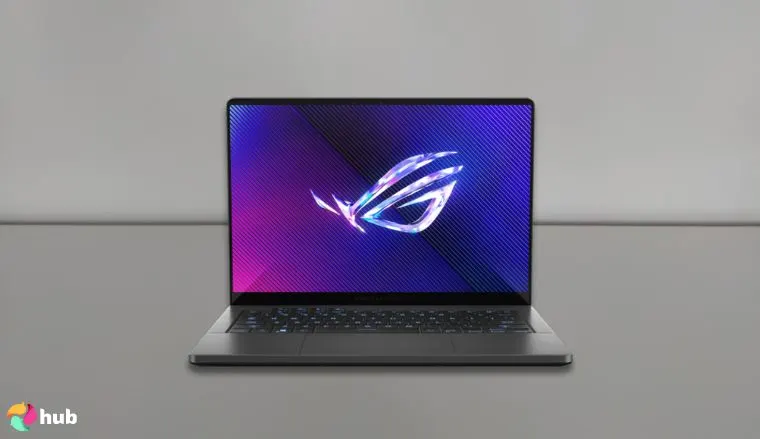 Asus Zephyrus G14 gaming laptop on a white office desk in a minimalist setup for a review