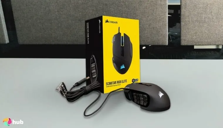 Corsair SCIMITAR RGB ELITE MMO Mouseon a white office desk in a minimalist setup for a review