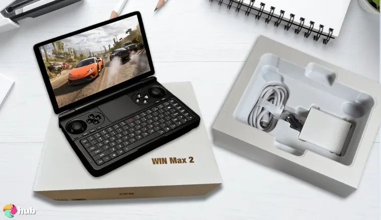 GPD Win Mini Handheld Gaming PC on a white office desk prepared for testing shots
