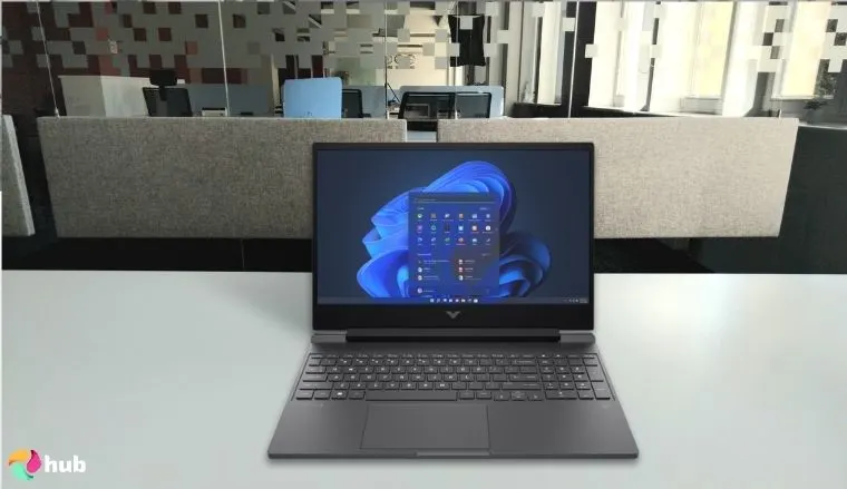 HP Victus 15 HP Gaming Laptop on a white office desk prepared for testing shots