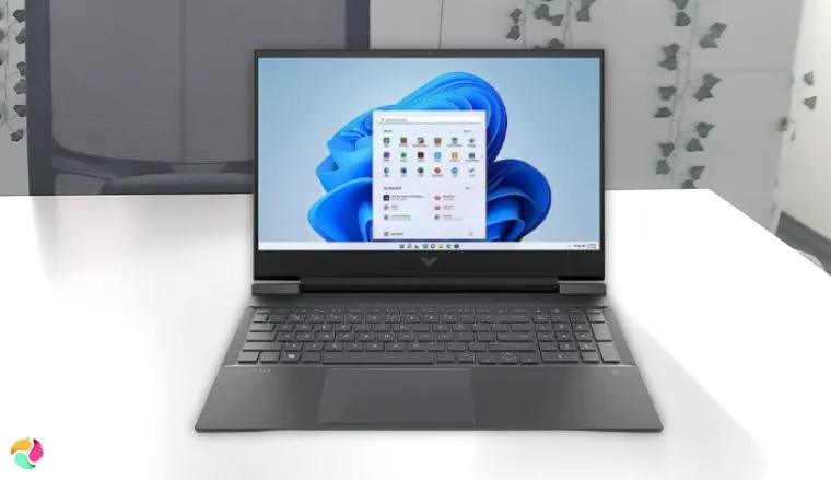 HP Victus 16.1 Ryzen 7 Gaming Laptop on a white office desk set up for testing and review