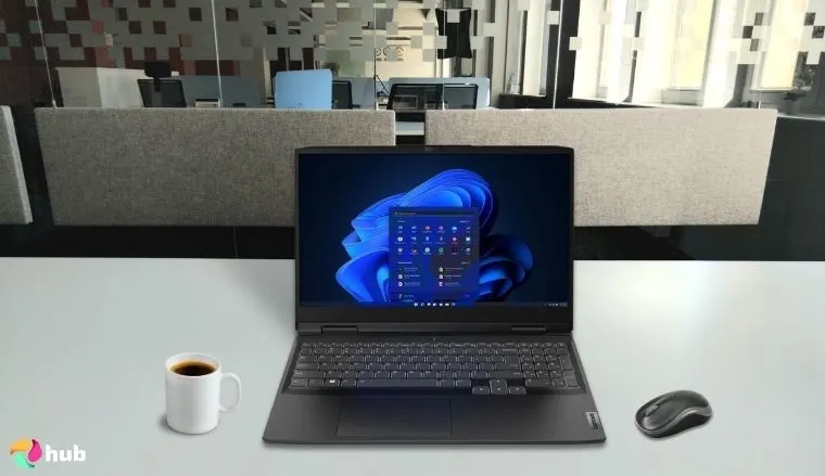 Lenovo IdeaPad Gaming 3 Laptop on a white office desk with minimal decor for a review