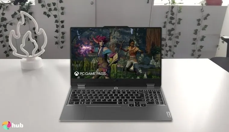 Lenovo LOQ Gaming Laptop on a white office desk with decorative items for a review