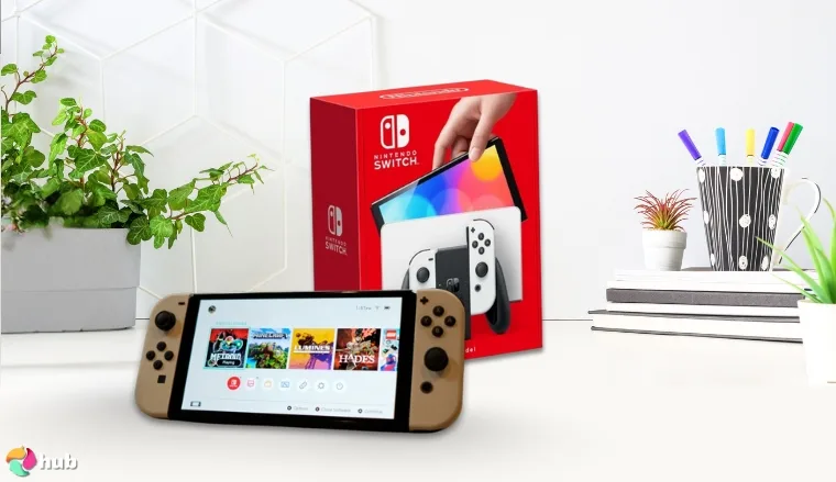 Nintendo Switch – OLED Model Handheld Gaming PC on a white office desk in a well-lit setting for a review