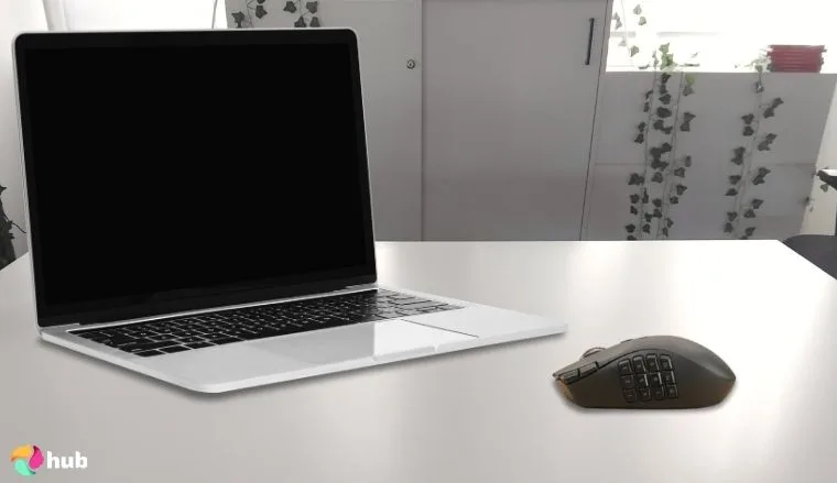 Razer Naga V2 HyperSpeed MMO Mouse on a white office desk with neat arrangement for a review