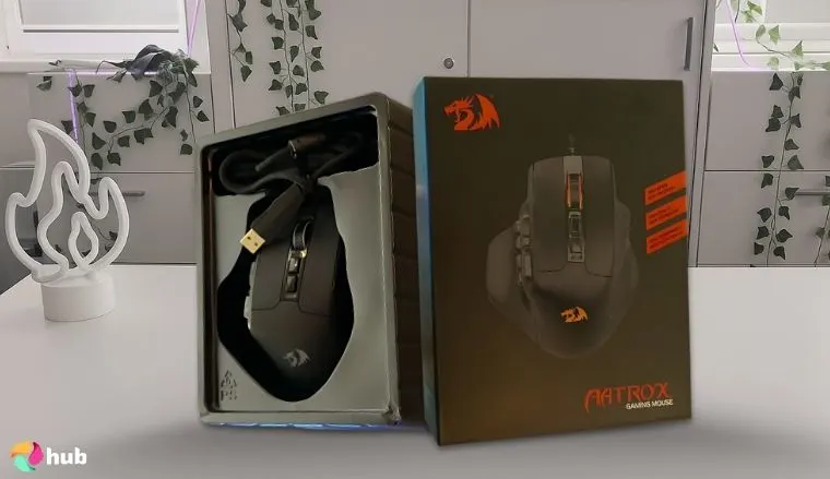 Redragon M811 Aatrox MMO Mouse on a white office desk arranged for a review