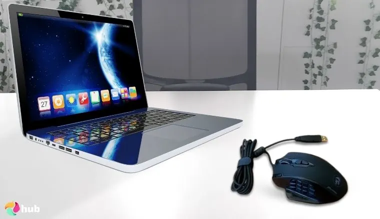 Redragon M908 Impact MMO Mouse on a white office desk positioned for photography