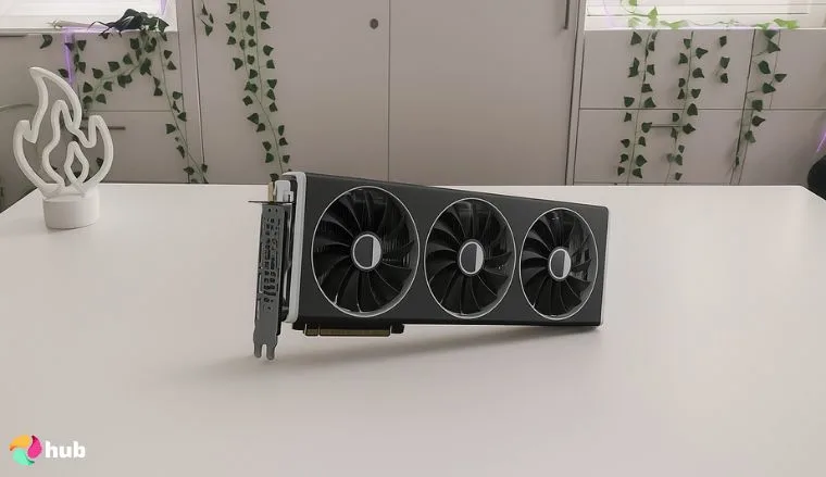 XFX Speedster MERC310 AMD GPU on a white office desk with decorative items for a review