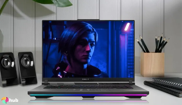 ASUS ROG Strix G16 Laptop for Gaming on a white office desk styled for promotional review