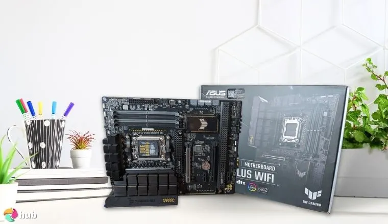ASUS TUF GAMING B650-PLUS Motherboard on a white office desk arranged for a review