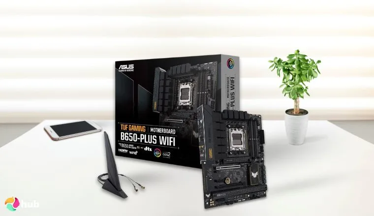 ASUS TUF GAMING B650-PLUS WIFI Motherboard on a white office desk with decorative items for a review