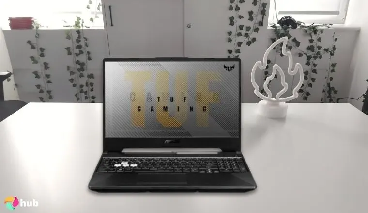 ASUS TUF Gaming A15 Laptop on a white office desk with simple styling for a review