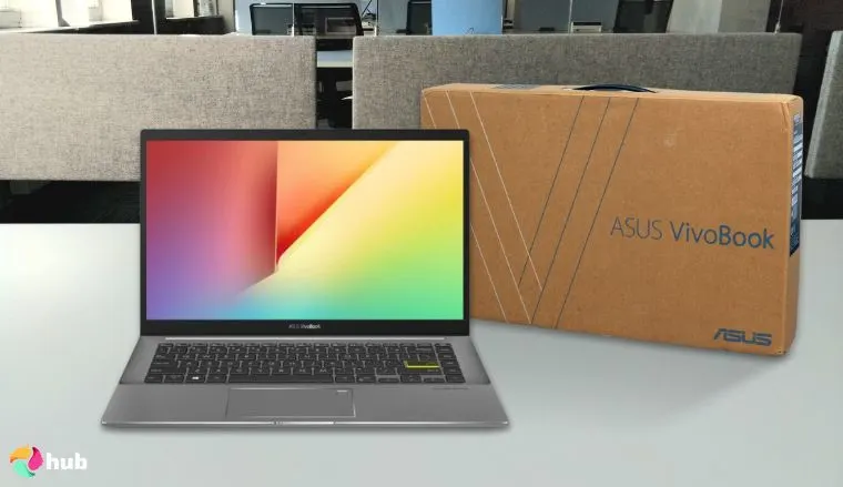 ASUS Vivobook S 14 Laptop on a white office desk in a bright workspace for a review