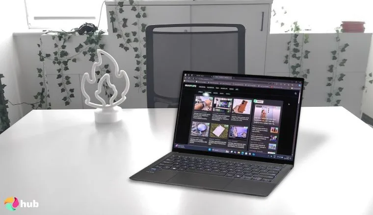 ASUS ZenBook S 14 Laptop on a white office desk with professional arrangement for a review