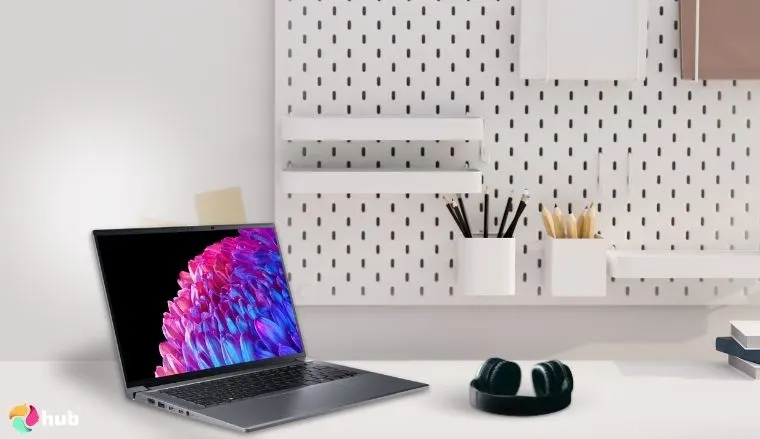 Acer Swift X 14 Laptop on a white office desk set up for testing and review