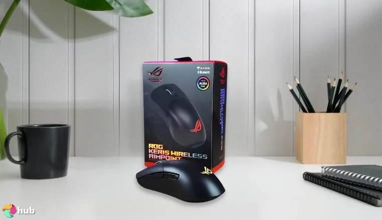 Asus ROG Keris Wireless AimPoint Gaming Mouse on a white office desk positioned for photography