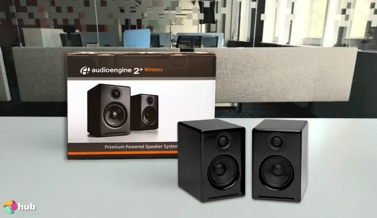 Audioengine A2+ Wireless Speakers on a white office desk with simple styling for a review