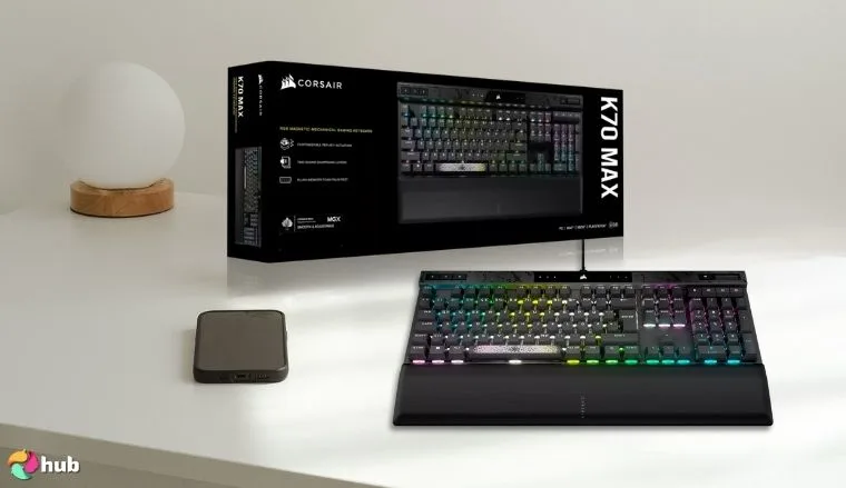 CORSAIR K70 MAX RGB Magnetic Mechanical Keyboard on a white office desk arranged for a review