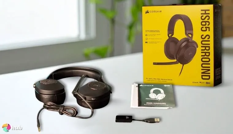 Corsair HS65 SURROUND Headset on a white office desk set up for testing and review