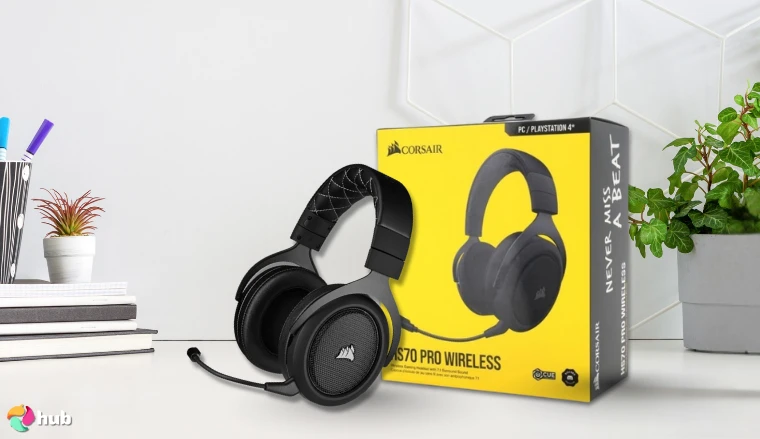 Corsair HS70 Pro Wireless Headset on a white office desk with decorative items for a review