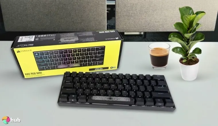 Corsair K65 PRO Mini RGB 65% Optical-Mechanical Keyboard on a white office desk with neat arrangement for a review