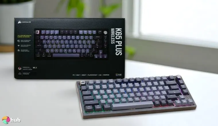 Corsair K65 Plus Wireless 75% RGB Hot-Swappable Mechanical Keyboard on a white office desk with natural shadows for a review