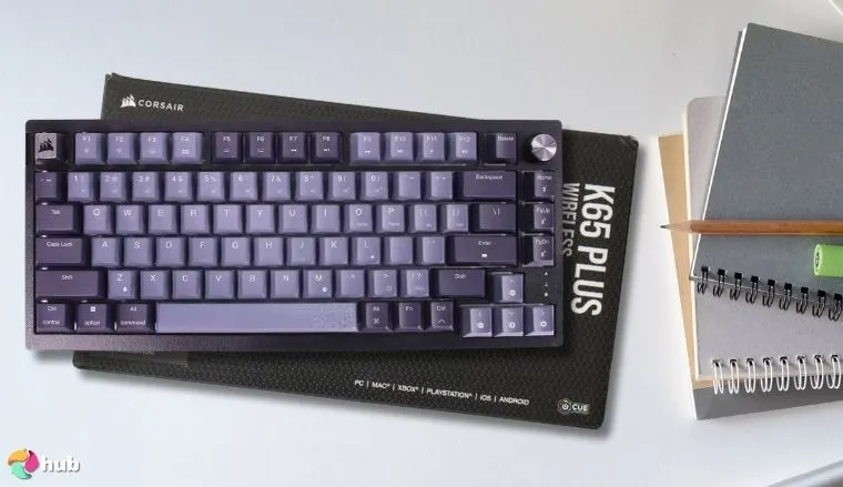Corsair K65 Plus Wireless 75% RGB Mechanical Keyboard on a white office desk styled for a review