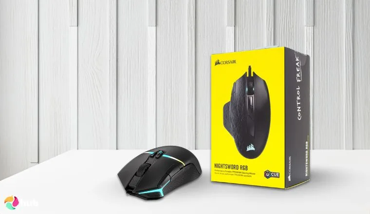 Corsair NIGHTSABRE RGB Mouse on a white office desk in a minimalist setup for a review
