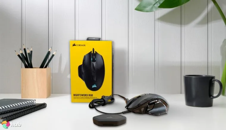 Corsair NIGHTSWORD RGB Gaming Mouse on a white office desk styled for promotional review