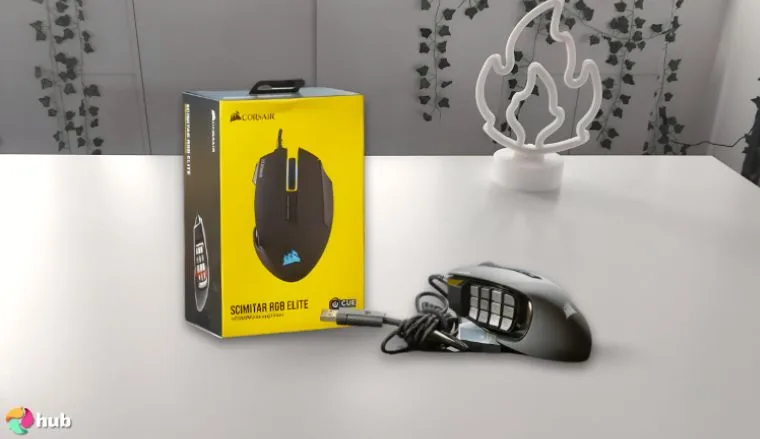 Corsair SCIMITAR RGB ELITE Gaming Mouse on a white office desk with professional arrangement for a review
