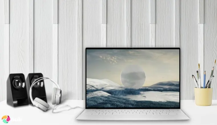 Dell XPS 13 9340 Laptop on a white office desk with balanced composition for a review