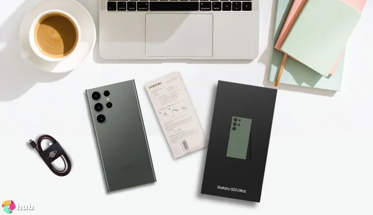 Galaxy S23 Ultra 5G Samsung smartphone on a white office desk with decorative items for a review