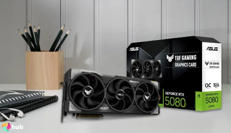 GeForce RTX 5080 NVIDIA GPU on a white office desk arranged for a review