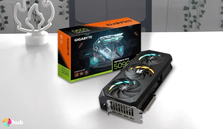 GeForce RTX 5090 NVIDIA GPU on a white office desk in a top-down view for a review