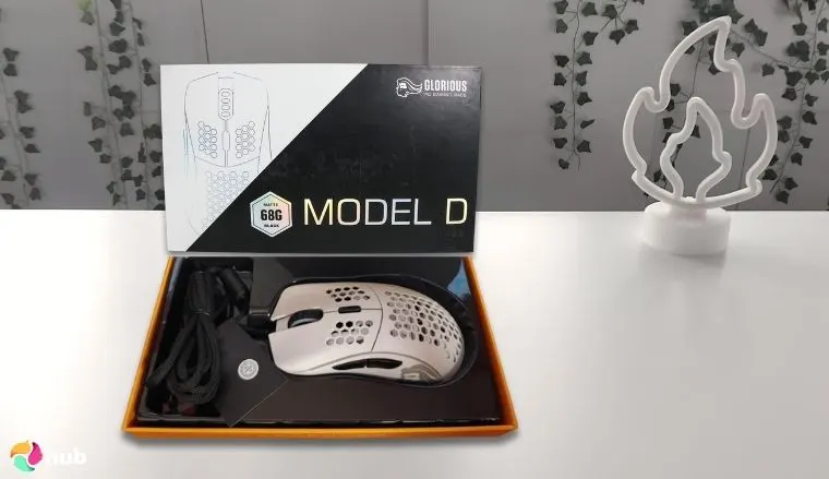 Glorious Model D Mouse on a white office desk in a clean setup for a review