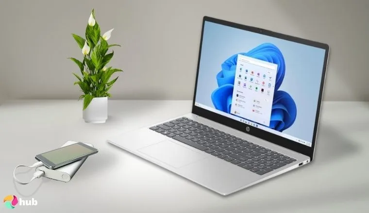 HP Display Graphics Windows 15-fc0502nr Laptop on a white office desk in a bright workspace for a review