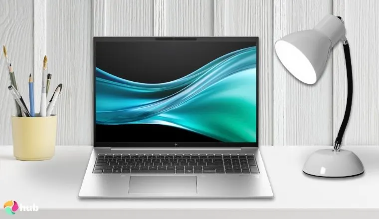 HP EliteBook 860 G11 Laptop on a white office desk in a top-down view for a review