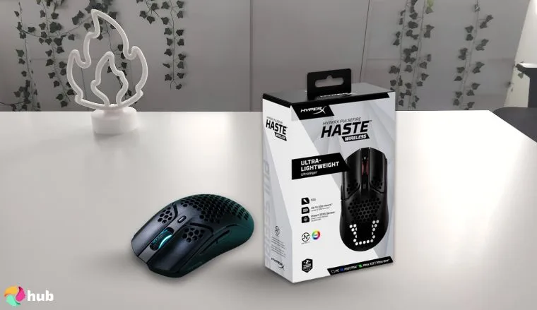 HyperX Pulsefire Haste Mouse on a white office desk with natural shadows for a review