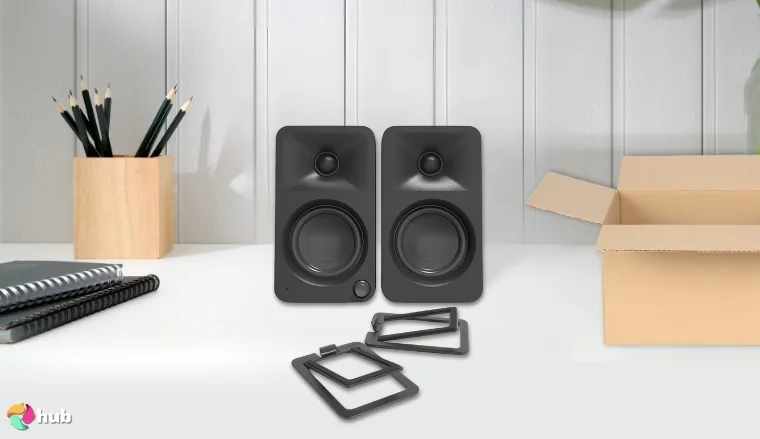 Kanto ORAMB Speakers on a white office desk in a clean setup for a review