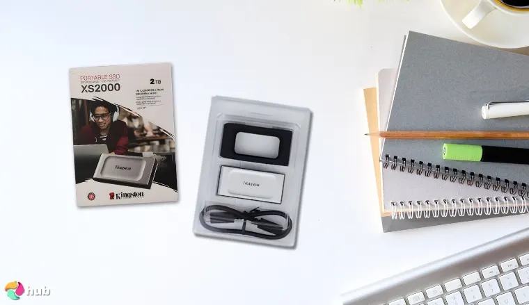 Kingston XS2000 SSD on a white office desk positioned for photography