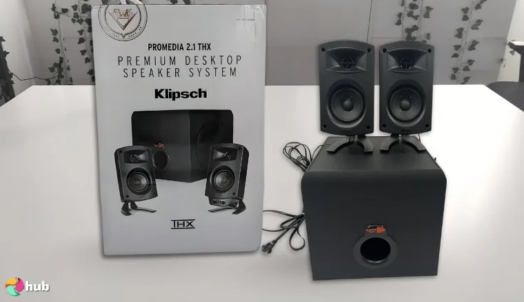 Klipsch ProMedia 2.1 Speaker System on a white office desk with soft lighting for a review