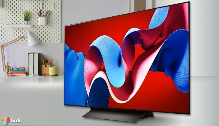 LG OLED evo C4 Series Smart TV on a white office desk in a top-down view for a review