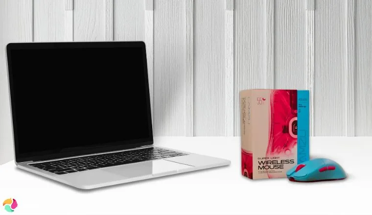 Lamzu Atlantis Mini Pro Mouse on a white office desk in a clean setup for a review