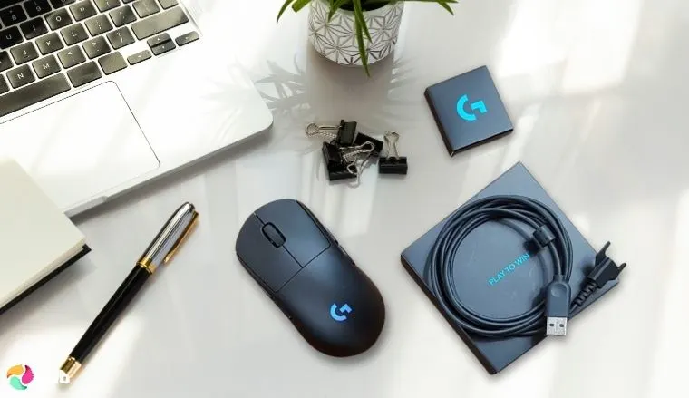 Logitech G Pro Wireless Gaming Mouse on a white office desk in a top-down view for a review